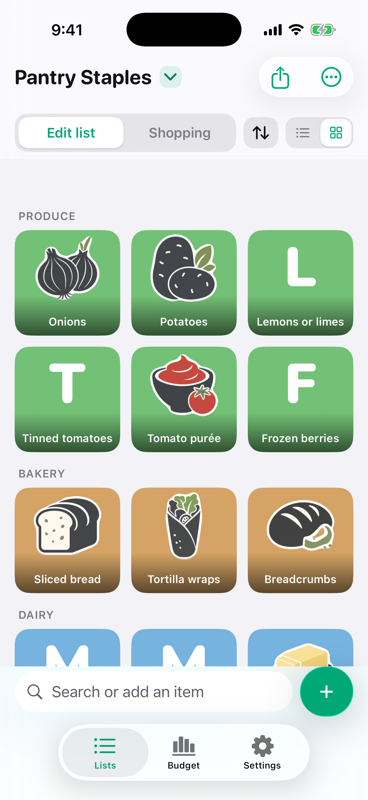 A Plenty list called “Pantry Staples” in grid view: Onions, Potatoes, Lemons or limes, Tinned tomatoes, Tomato purée and Frozen berries under PRODUCE, then Sliced bread, Tortilla wraps and Breadcrumbs under BAKERY.